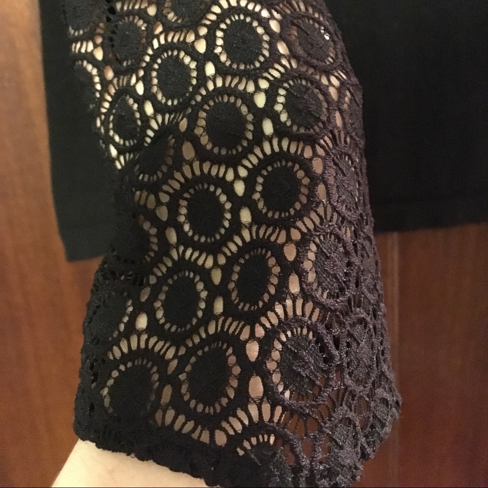 Sweater with detailed neck and sleeves